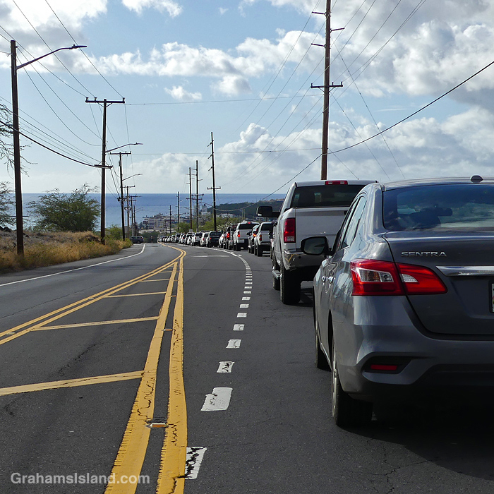 Cars wait on the road into Kawaihae Hawaii as a traffic accident is cleared