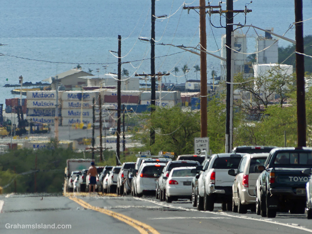Cars wait on the road into Kawaihae Hawaii as a traffic accident is cleared
